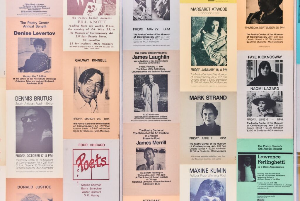 A wall collage of vintage Poetry Center event posters featuring readings by poets including Denise Levertov, Dennis Brutus, Bill Knott, Galway Kinnell, Margaret Atwood, James Laughlin, Mark Strand, Maxine Kumin, Faye Kicknosway, Naomi Lazard, and Lawrence Ferlinghetti.